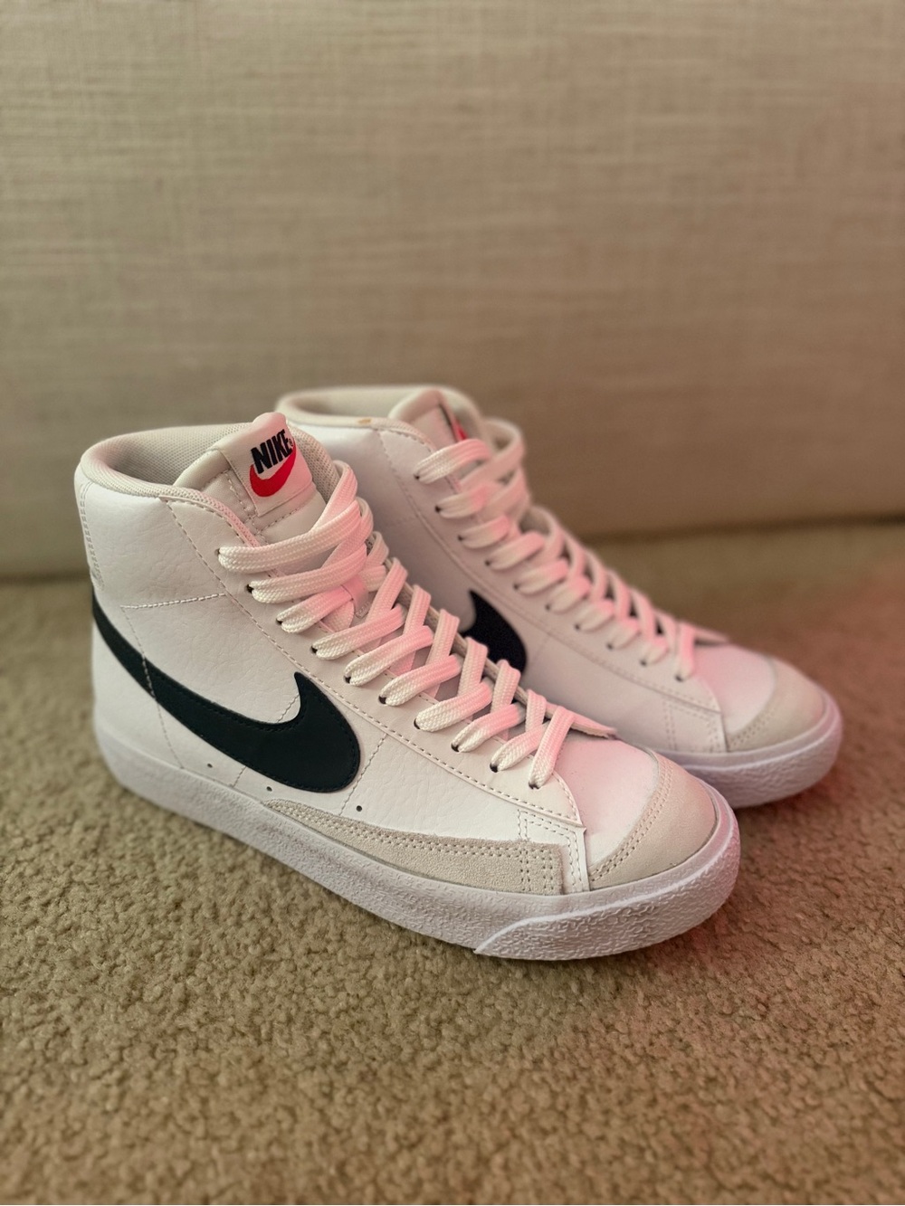 Nike White High-Top Sneakers with Black Swoosh and Pink Accent